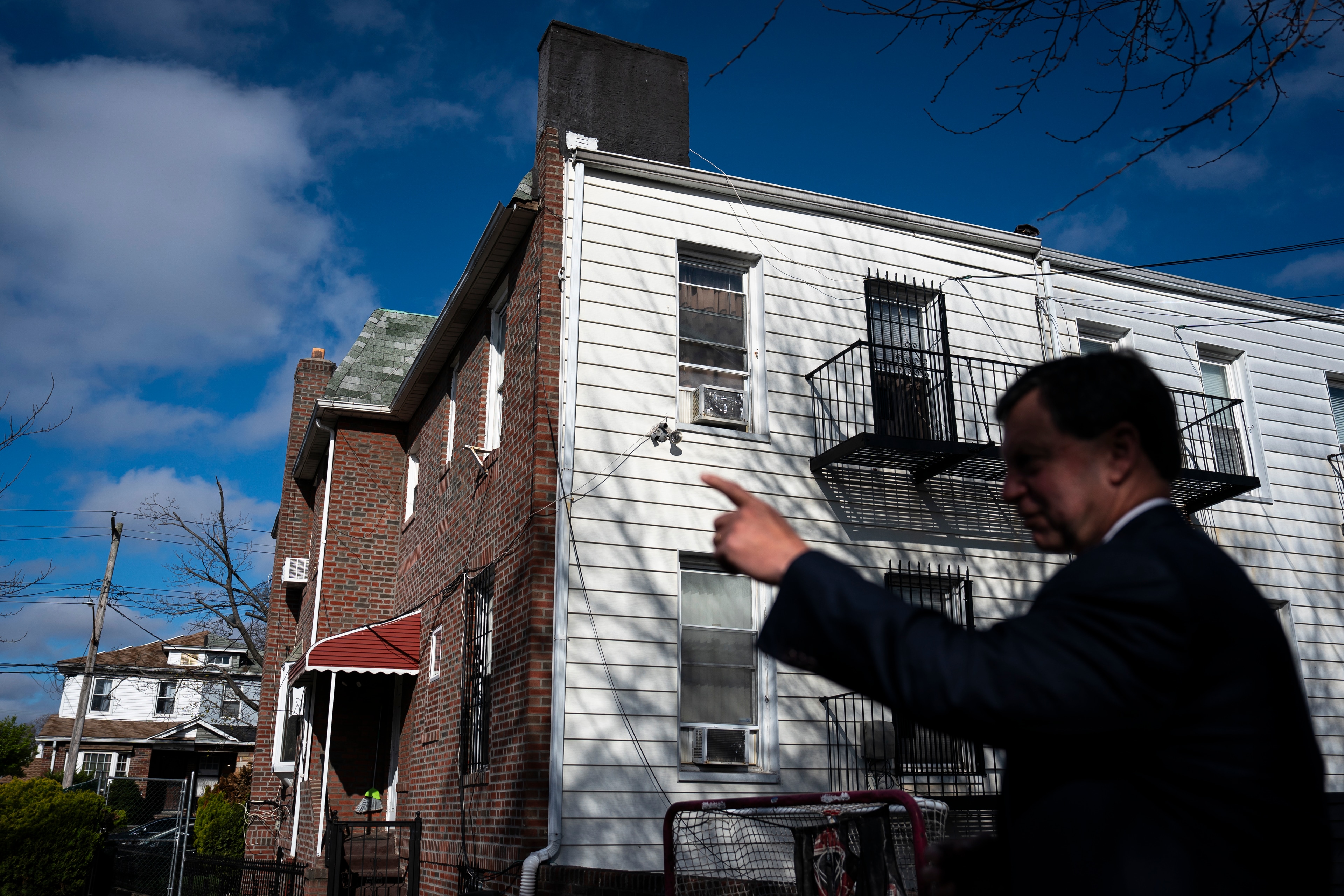 Frank Bisignano points to his childhood home in Mill Basin, Brooklyn